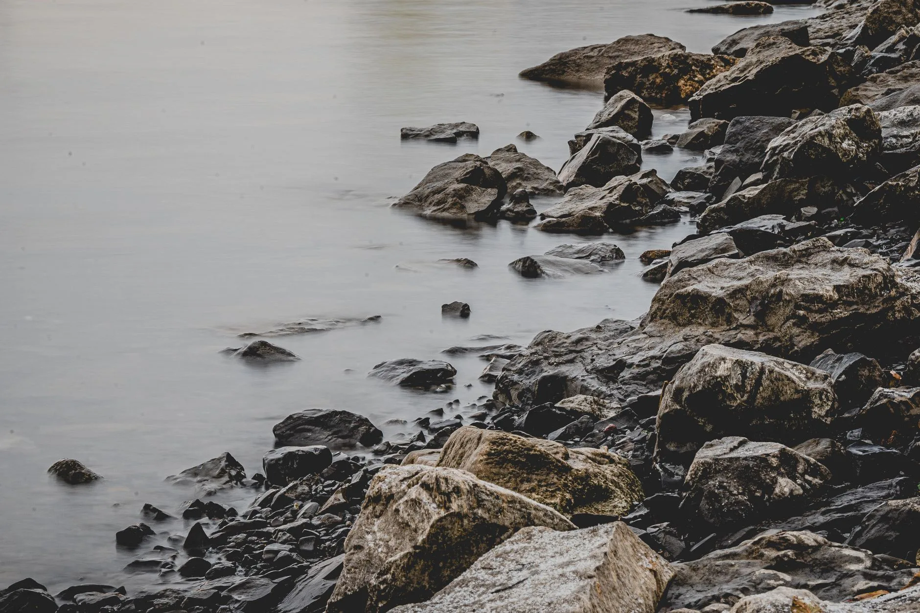 Peaceful water at dawn — the settled calm that holds even when circumstances are uncertain